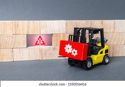 A Forklift Truck Brings A Red Block To A Void In The Wall. Repair Work, Elimination Of Gaps. Improving System Security, Fixing Errors And Bugs. Integration Of Solutions And Problem Solving