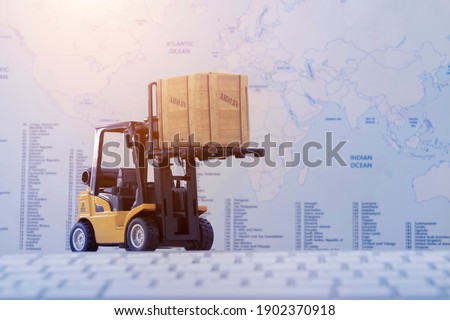 Forklift truck handling cargo shipping container box with worldmap background use as online tracking technology of worldwide logistic, shipping, import and export concept.