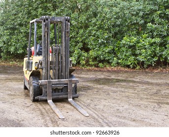 Forklift Truck Outside On Wet Concrete