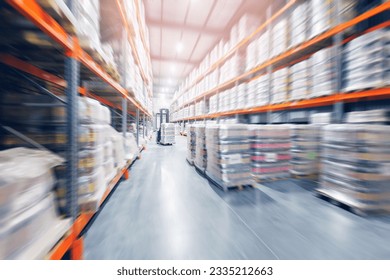 Forklift working in brewery warehouse stock industrial premises for storing kegs with beer. Concept logistics, transport. Motion blur effect, sunlight. - Powered by Shutterstock