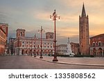 Forli, Emilia-Romagna, Italy: cityscape of the main square Aurelio Saffi with the ancient abbey of San Mercuriale and the post office building of 1932