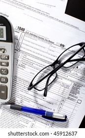 Form 1040. Standard US Income Tax Return. Calculator. Eyeglasses