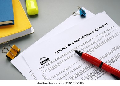 Form 13930 Application for Central Withholding Agreement phrase on the piece of paper. - Shutterstock ID 2101439185