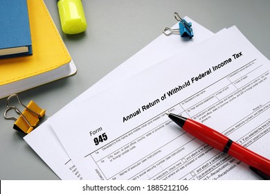 Form 945 Annual Return of Withheld Federal Income Tax phrase on the page. - Shutterstock ID 1885212106