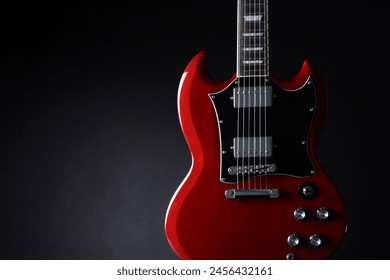 The form of an electric guitar photographed against various backgrounds - Powered by Shutterstock