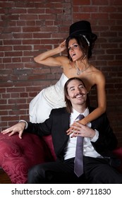 Formal Dressed Couple On A Red Chase Lounge