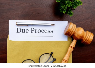 A formal "Due Process" document on a desk, paired with a gavel and eyeglasses, reflecting legal scrutiny and procedural fairness.