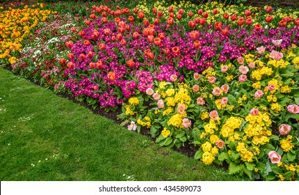 A Formal Garden Border Of Spring Flowers.