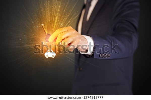 Formal man\
hand over shiny keys with dark\
background