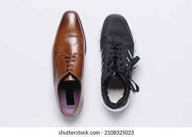Formal and sports shoes on light background