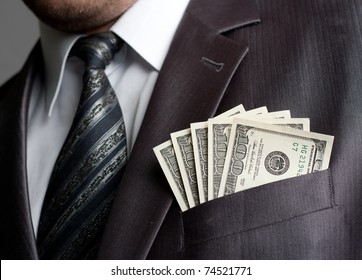 Formalweare Businessman With Earned Money In Suit Pocket