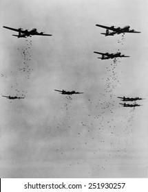 Formation Of B-29's Releasing Incendiary Bombs Over Japan In June 1945. World War 2.