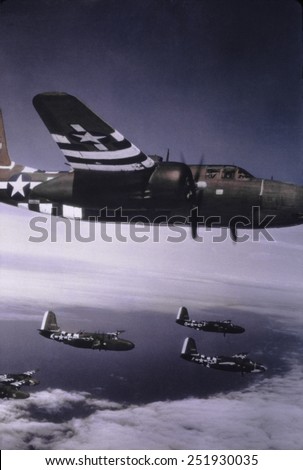 Formation of Douglas A-20's over France during the D-Day invasion in June 1944. They are painted with bold white 'invasion stripe' to ease identification and prevent 'friendly fire' casualties.