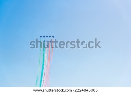 Formation flying of Frecce Tricolori on a sunny day, Italy