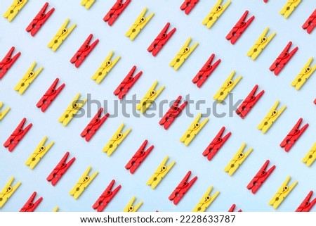 Formation of objects, repetitive group of clothespin colorful pattern, crowd top view