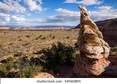 A Formation Of Sandstone Sits Ten Meters Tall Above Sand And Sagebrush Of Northern Arizona On The Kaiparowits Plateau