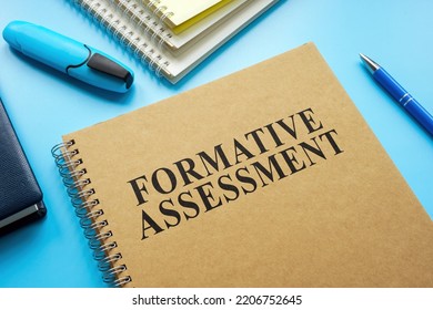 Formative Assessment guide and notebooks on the desk. - Shutterstock ID 2206752645