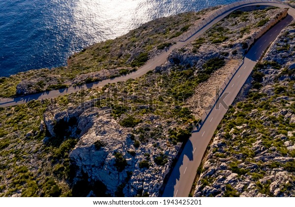 Formentor Lighthouse road. Tramuntana cliffs.\
Mediterranean sea with clean blue\
sky