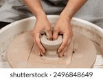 Forming the proper size and shape of pottery with increasing speed of a pottery wheel. Making a bowl on a pottery wheel with your own hands