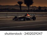 Formula 1 car go fast at the raceway during sunset