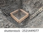 Formwork with reinforcement bar for pad footing. Construction of pad footing foundation where the pads are used to support columns or structural framework within the superstructure.