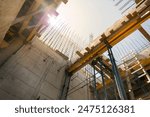 Formwork supports the second floor of a monolithic building. Reinforcement of walls and ceiling. Monolithic work during the construction of a building close-up. construction technologies