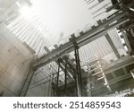 Formwork supports the second floor of a monolithic building. Reinforcement of walls and ceiling. Monolithic work  of a building close-up. construction technologies black and white photo