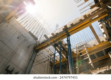 Formwork supports the second floor of a monolithic building. Reinforcement of walls and ceiling. Monolithic work during the construction of a building close-up. construction technologies