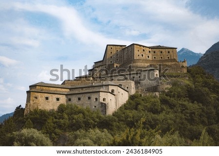 The fort of Bard (Forte di Bard) in Aosta Valley, Italy, during a cloudy summer day