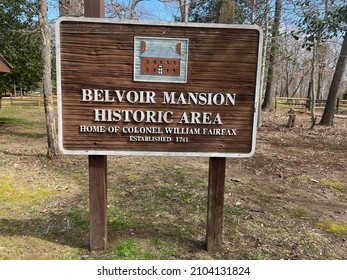 Fort Belvoir, Virginia, USA - March 14, 2021: A sign marks the entrance to a trail to the "Belvoir Mansion Historic Area" on Fort Belvoir Army post in Fairfax County, Virginia.