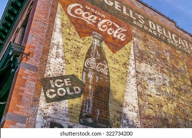 FORT COLLINS, CO, USA, AUGUST 30,  2015: A Vintage Ad For Coca-Cola - A Faded Mural On A Building Wall In Fort Collins Old Town.