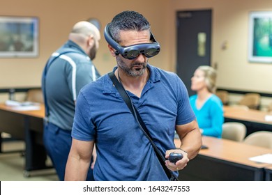 Fort Lauderdale, FL / USA - 2/10/2020: Broward County Directors And Employee Staff Wearing Magic Leap 1 Augmented Mixed Virtual Reality Headsets Learning About Spatial 3D Computing.