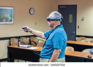 Fort Lauderdale, FL / USA - 2/10/2020: Broward County Directors And Employee Staff Wearing Magic Leap 1 Augmented Mixed Virtual Reality Headsets Learning About Spatial 3D Computing.