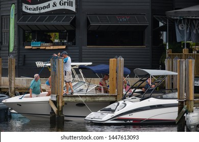 FORT LAUDERDALE, FL, USA - JULY 8, 2019: People Docking A Boat On The Tarpon River