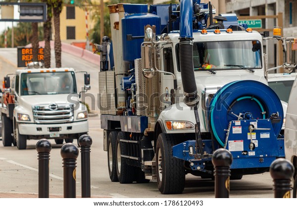 Fort Lauderdale, Florida / USA - 2/27/2019:\
Sewer and drainage cleaner truck with the cities logo and colors\
downtown to fix issues of known backups on Andrews and Las Olas as\
an emergency situation