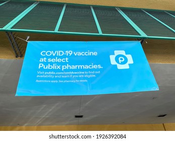 FORT LAUDERDALE, FLORIDA, USA:  Covid Vaccine Banner Hanging In Front Of Publix Super Market In Harbor Beach Shopping Center As Seen On February 27, 2021. 