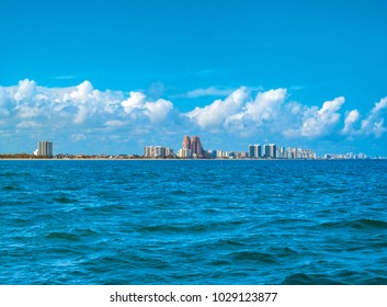 Fort Lauderdale, Near Miami, Florida, USA. 
Landscape Of Beach Skyline And Coastal Luxurious Buildings Against Blue Sky A Summer Sunny Day. Panoramic View From The Ocean Surface.