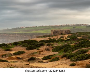 Milreu’s fort, located in-between the Mil Regos and Alibaba’s beaches, under a cloudy sky. Ericeira – Portugal