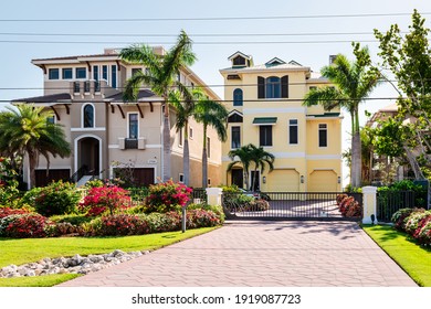 Fort Myers Beach, USA - April 29, 2018: Florida gulf of mexico coast with luxury expensive houses buildings waterfront architecture modern gated architecture