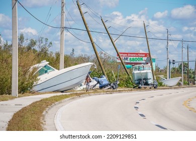 Fort Myers, FL, USA - October 1, 2022: Boats Laying On The Side Of The Road In Fort Myers FL Hurricane Ian Aftermath