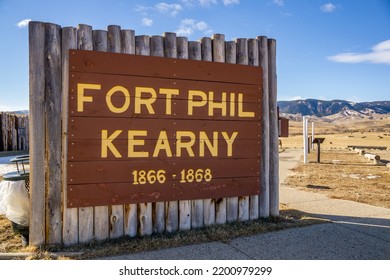 Fort Phil Kearny State Historic Site log post entrance sign written in yellow letters.