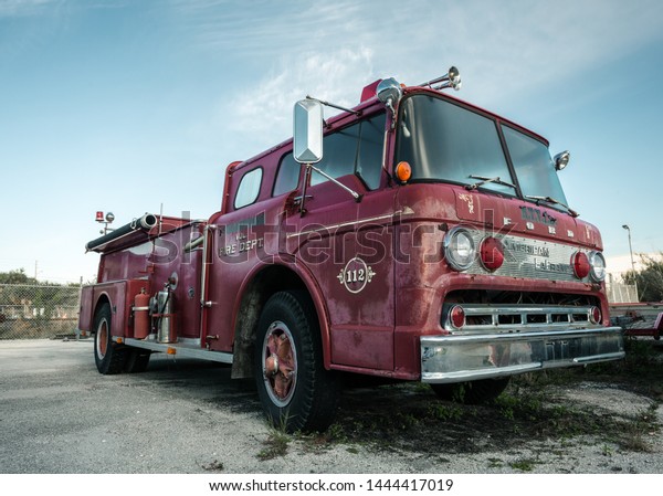 Fort Pierce/Florida/USA -\
February 19th 2014. Old weathered red fire truck in Fort Pierce \
Florida. 