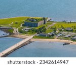 Fort Rodman and Clarks Point Lighthouse aerial view at Fort Taber Park at the mouth of Acushnet River at harbor of New Bedford, Massachusetts MA, USA. 