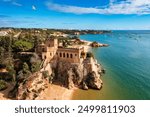 The Fort of Sao Joao do Arade (Castle of Arade) in Ferragudo Village, Algarve. Beach and castle Sao Joao do Arade in Ferragudo in the Algarve in Portugal.