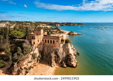 The Fort of Sao Joao do Arade (Castle of Arade) in Ferragudo Village, Algarve. Beach and castle Sao Joao do Arade in Ferragudo in the Algarve in Portugal. - Powered by Shutterstock