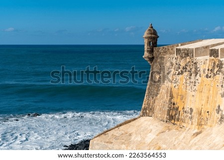 Fort wall sentry box above the Caribbean Sea. Bartizan or garita at Castillo San Felipe del Morro, San Juan, Puerto Rico. Icon appears on Puerto Rican license plates and quarters. 