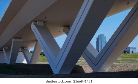 Fort Worth, Texas, United States - May 28, 2022: Picture Of Triangle Bridge Piers With Fort Worth City Hall In The Background.