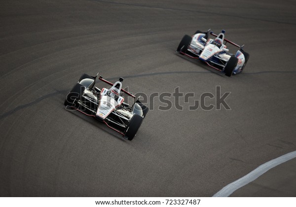 Fort Worth,\
Texas, USA - June 7th 2013 - Izod Indycar Series Firestone 550 -\
Texas Motor Speedway - Team Penske Indy drivers, Will Power (12)\
and Helio Castroneves (3) in turn\
1.
