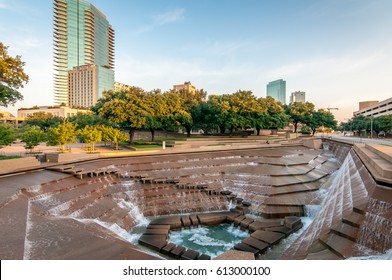 Fort Worth, Texas Water Gardens. Downtown public park and architectural image. Rushing water over the concrete structures. Summer day in the city.   - Shutterstock ID 613000100