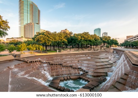 Fort Worth, Texas Water Gardens. Downtown public park and architectural image. Rushing water over the concrete structures. Summer day in the city.  